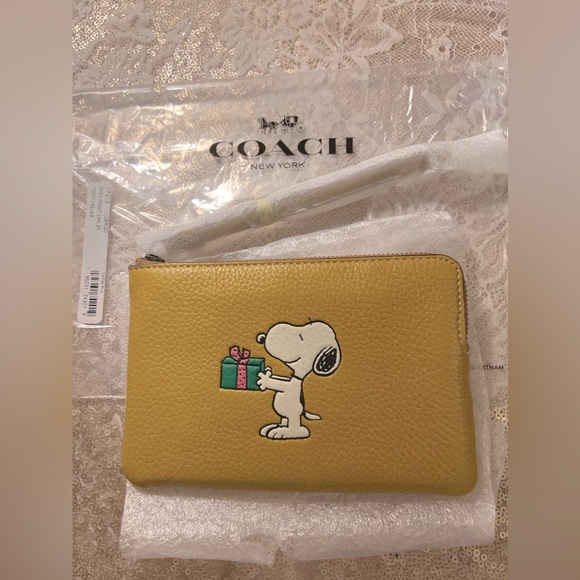 COACH x PEANUTS Bags Coach X Peanuts Snoopy Wristlet New Poshmark
